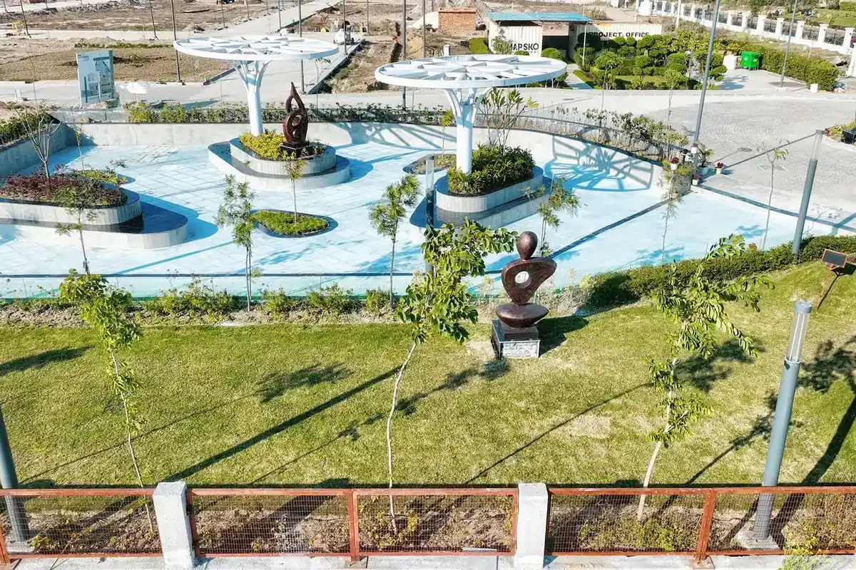 Professionally designed landscape garden with canopy structures inside Mapsko ASPR Greenz, Sector 35 Sonipat