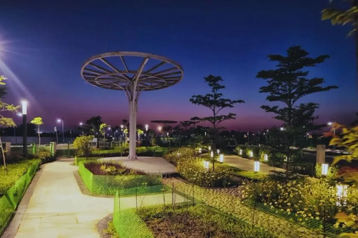 Illuminated landscape garden with canopy and walkway at night inside Mapsko ASPR Greenz Sector 35 Sonipat