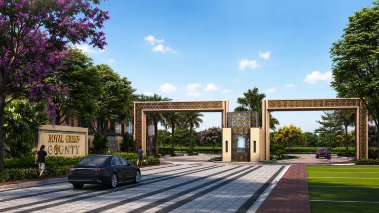 Royal Green County main entrance gate with landscaped driveway and signage in Kundli Sonipat